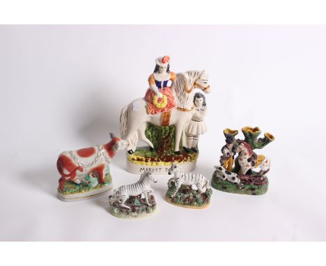 A collection of Staffordshire pottery including a pair of Zebras, Continental figures and two part wash basin sets