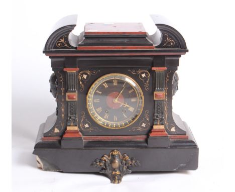 A Victorian slate 'black marble' cased mantle clock with drum movement, case with damage, lock pendulum and key, 43cm wide 