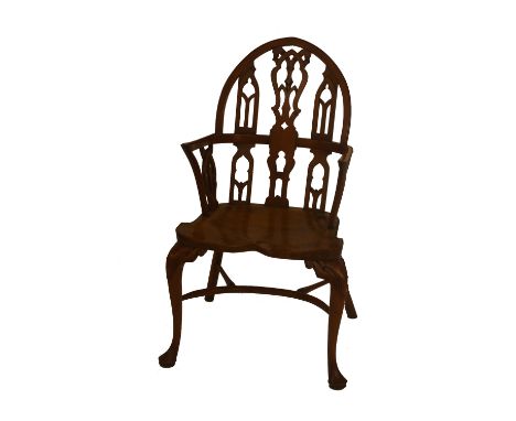 A George III style yew Windsor chair with pierced arch back, shaped seat and cabriole legs