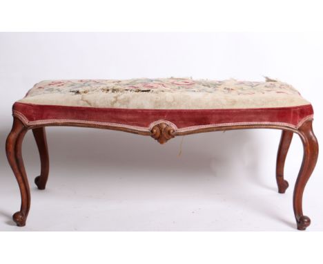 A Victorian long stool with mahogany scroll legs and tapestry top, w: 97cm