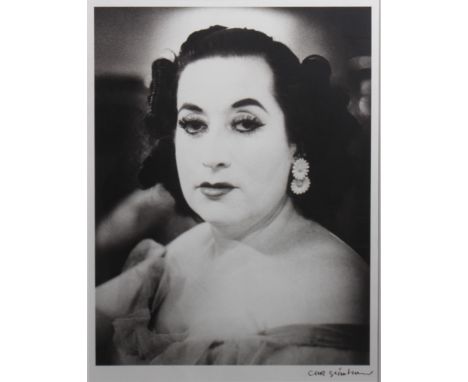 A black and white portrait of a lady indistinctly signed lower right, possibly Monseratt Cabelle 