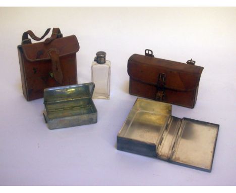 Two leather cases one marked Finnigans Manchester & Liverpool containing silver plated sandwich boxes, one with a box and a f