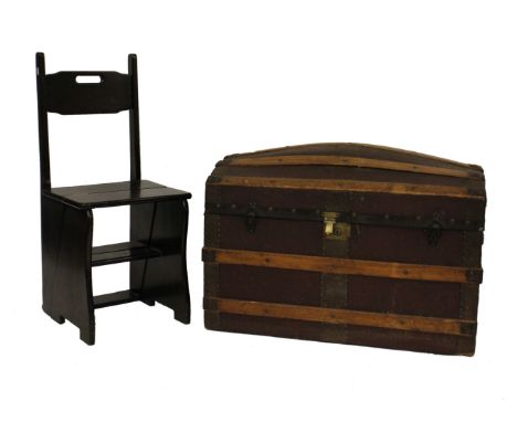A Victorian dome top trunk, fully banded and a metamorphic step/chair