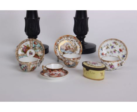 A pair of Ceylonese ebony dwarf candlesticks (21cm), a Limogue flower painted patch box and four miniature china cups and sau