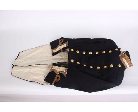 A Naval Officer uniform, the coatee with Gieves, Matthews and Seagrove label bearing R.G.Llewellyn name and dated 15/9/1912, 