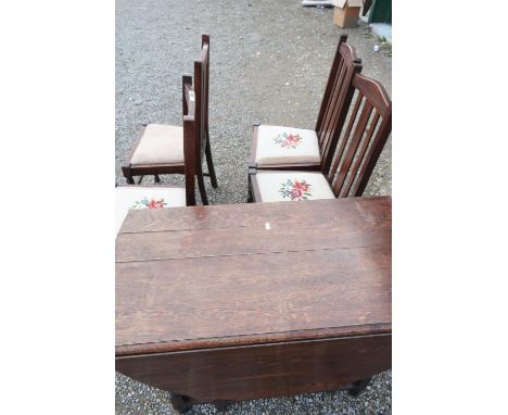 20th C oak drop-leaf gate-leg dining table on barley twist legs, and a set of four similar rail back dining chairs with tapes