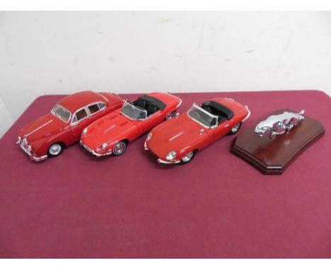 Two 1:18 scale models of E type Jaguars, another Jaguar mk2 1959 and a Jaguar mascot on plinth (4) 