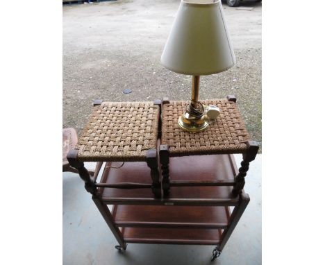 Vintage oak three tier drinks cart on sprung casters, a pair of top oak topped stool and small  table lamp 