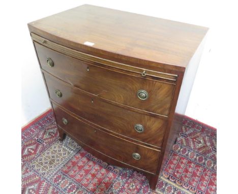 19th C mahogany bow front  bachelors chest, with brushing slide above three long cock-beaded drawers with brass ring handles,