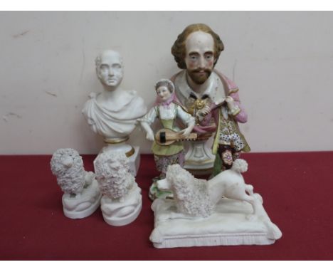 Three bisque figures of poodles, two continental porcelain figures of a couple, small ceramic bust of Earl Grey, and another 