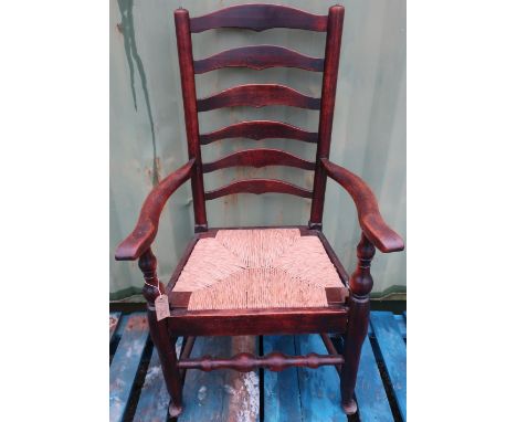 19th C rush seated ladder back arm chair 