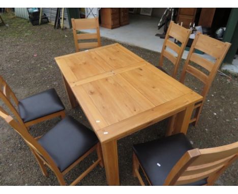 Rectangular extending oak kitchen table on square supports L125cm x W89cm, and a set of six high ladder back chairs with upho