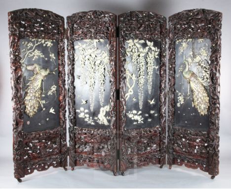 An impressive Japanese carved wood, ivory and Shibayama four-fold screen, by Kobayashi, Meiji period, decorated on one side i