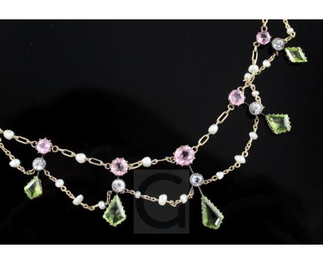 An Edwardian 15ct gold and multi gem set fringe necklace, including peridot, pink tourmaline and seed pearl, 42cm.
