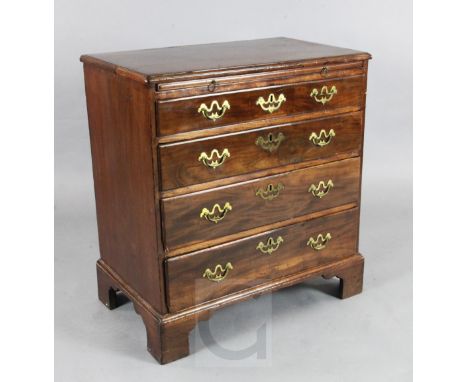 A George III mahogany chest, fitted brushing slide and four graduated long drawers, on bracket feet, W.2ft 5in. D.1ft 5in. H.