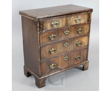 A George III mahogany bachelor's chest, with folding top over two short and three graduated long drawers, on bracket feet, W.