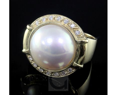 A modern 14ct gold, mabe pearl and diamond set dress ring, size T.