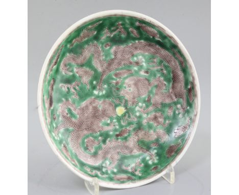 A Chinese Susancai 'dragon' saucer dish, Kangxi mark and of the period (1662-1722), the interior and exterior band incised wi