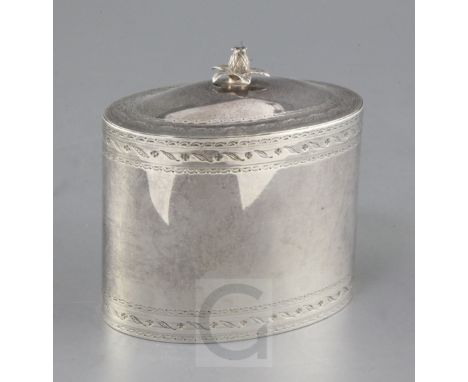 A George V 18th century style silver oval tea caddy, with bright cut engraved decoration and pineapple finial, maker, LA, Lon