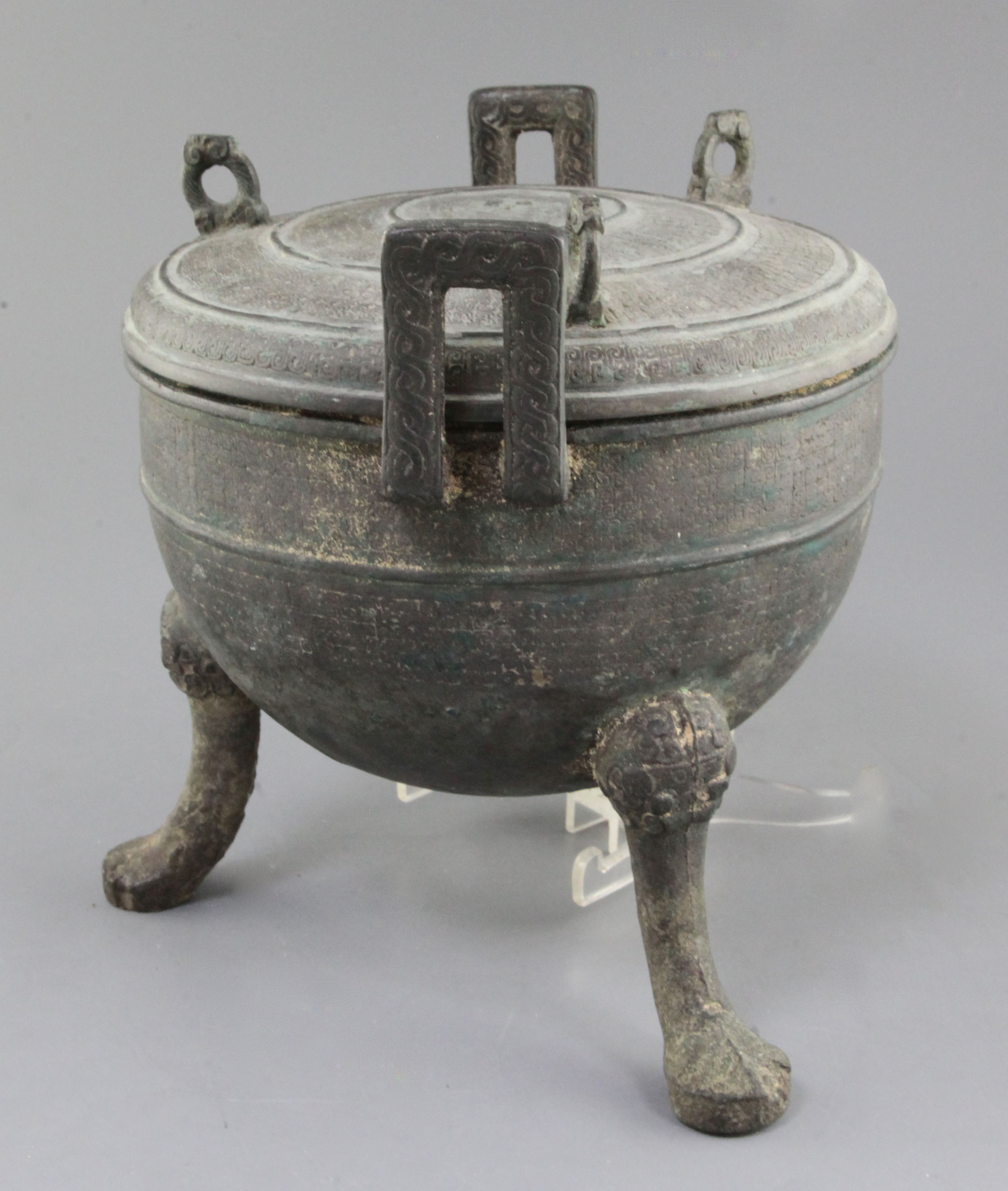 A Chinese archaic bronze ritual food vessel and cover, Ding, Eastern ...