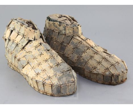 A pair of Chinese archaic sectional grey-green jade shoes, probably Han dynasty, composed of quadrilateral jade tiles, with l