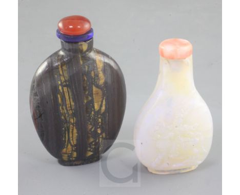 A Chinese carved opal snuff bottle and tiger's eye mineral snuff bottle, early 20th century the opal snuff bottle of flattene