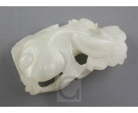 A Chinese white jade carving of a goldfish amid lotus, late 19th / early 20th century, the stone of good even tone, 6.4cmFrom