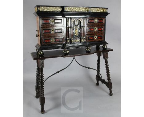 A late 17th / early 18th century rosewood, ebony and red tortoiseshell mounted vargueno on stand, with cast brass gallery and