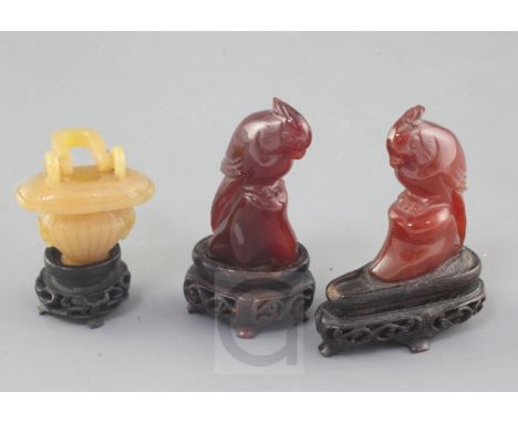 Three Chinese chalcedony carvings, late 19th century, the first in the form of a basket with articulated handle, 5.3cm, wood 