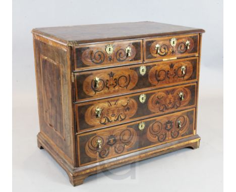 A late 17th century walnut marquetry and oyster veneered chest, decorated with foliate scrolls, on later bracket feet, W.3ft 