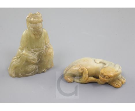 Two Chinese soapstone figures, 19th century, the first of a recumbent mythical beast, the second a seated a figure of Guanyin