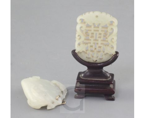 A Chinese pale celadon jade plaque and a white jade carving of a peach, 19th century, the plaque carved and pierced with the 