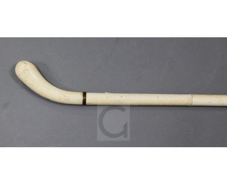 A 19th century turned and carved ivory walking stick, 35in.