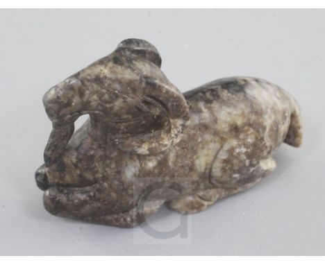 A Chinese grey and black mottled jade figure of a recumbent ram, 18th / 19th century, length 6cm