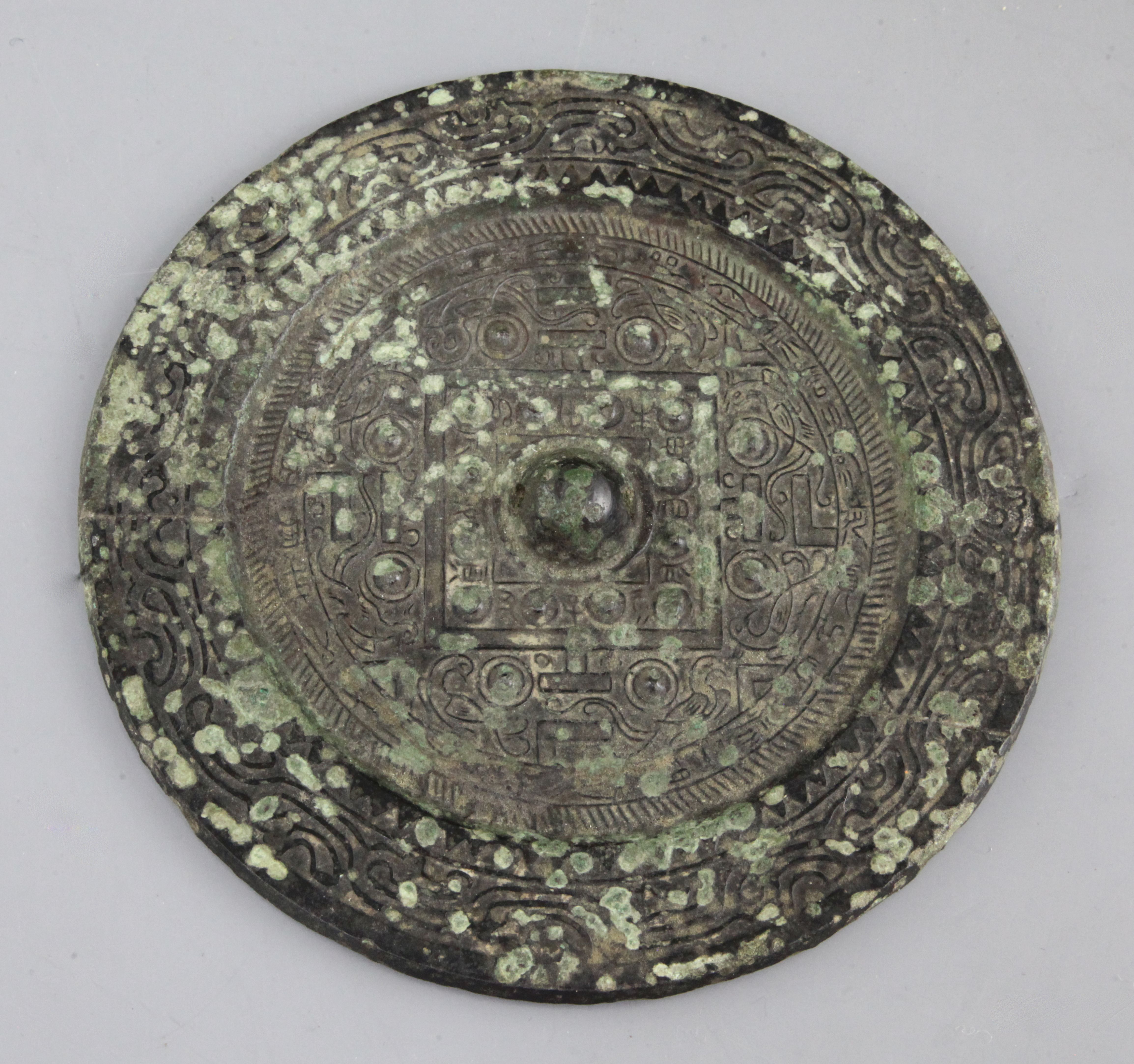 A Chinese bronze circular TLV mirror, Han dynasty, 1st century B.C ...