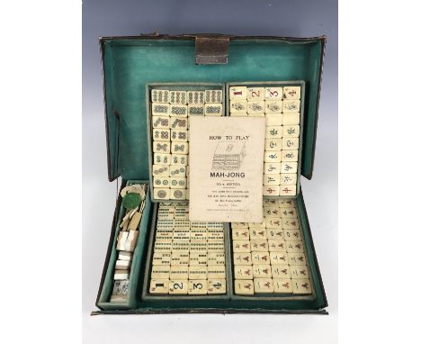 An early 20th Century bone and bamboo Mah-Jong set manufactured and retailed by the Chun Wah Trading Company of Shanghai, in 