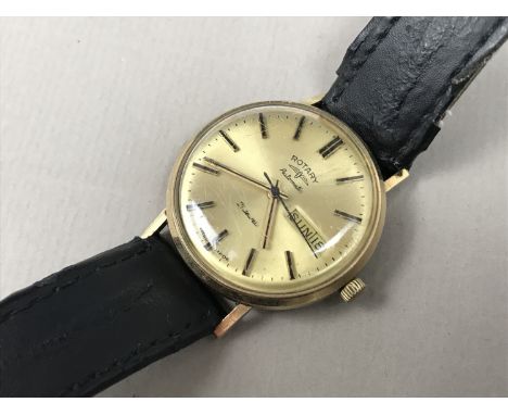 A gentleman's 9ct gold cased Rotary Automatic wrist watch, having 21 jewel movement, a radially brushed gilt face, calendar a