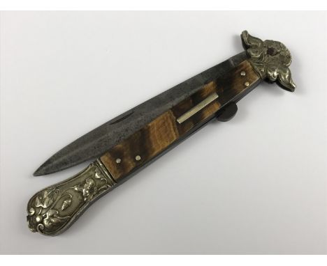 A Victorian folding stiletto, the hilt having horn grip scales and Art Nouveau influenced "German silver" mounts, the locking