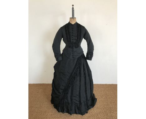 A Victorian black faille and satin three-piece dress retailed by Palmer of London, comprising bodice, skirt and pantaloons, t