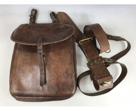 An Army officer's Sam Browne belt and shoulder strap, together with a First World War cavalry officer's saddle bag embossed W