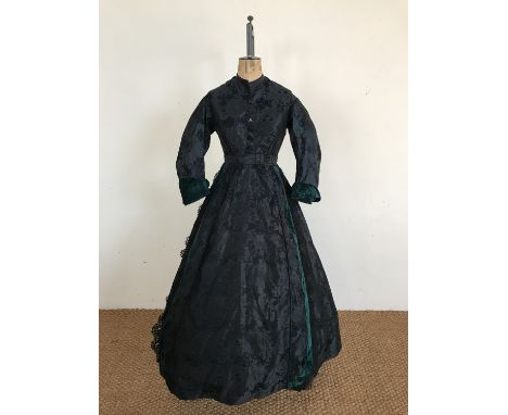 A Victorian emerald green and black brocade tablier dress, comprising one-piece dress and waist-belt peplum, the former havin