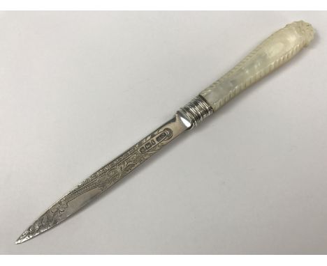 An Edwardian silver letter opener, having carved mother of pearl grip scales and an engraved blade, P Ashberry and Sons, Shef