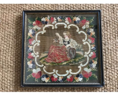 A Victorian gros- and petit-point woolwork tapestry, depicting a recumbent young girl holding aloft a song bird, reserved wit