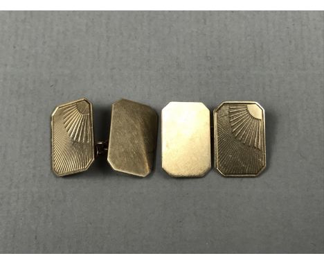 A gentleman's pair of 9ct gold cuff links, of rectangular form with canted corners, having radially engine-turned decoration,