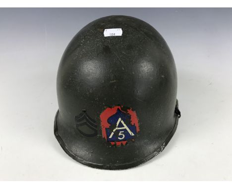 A Second World War US Army M1 steel helmet, bearing 5th Army and rank decals