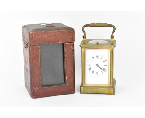 An early 20th century brass cased repeater carriage clock having a white enamel dial with Roman numerals, the 8 day movement 