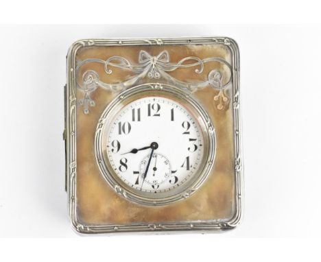 An early 20th century Goliath nickel plated 8 day clock in a fitted silver and leather case, the watch having a white enamel 