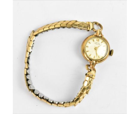 A Favre Leuba, manual wind, ladies 9ct gold wristwatch having a white enamel dial with baton markers, on a gold plated expand