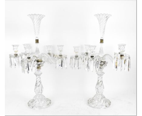 A pair of Baccarat five light candelabra, with central petal rim trumpet vase above five twist moulded glass s-scroll arms ho