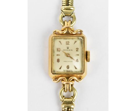 A Rolex manual wind, ladies 18ct gold cased wristwatch having a silvered dial signed Rolex, with gilt Arabic and baton hour m